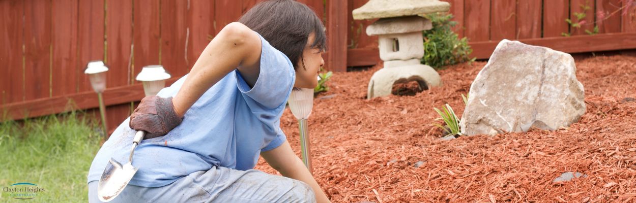 Gardening and back pain with bark mulch