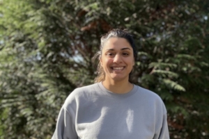 Happy young woman outside smiling clayton heights chiropractic